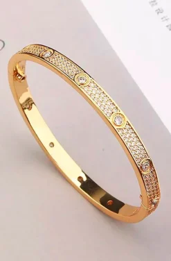 PULSERA CLAVOS CIRCONITAS DORADA