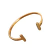 PULSERA DOBLE T