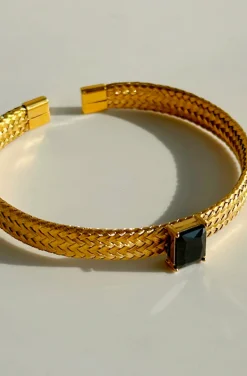 PULSERA DORADA DE ACERO CRISTAL NEGRO